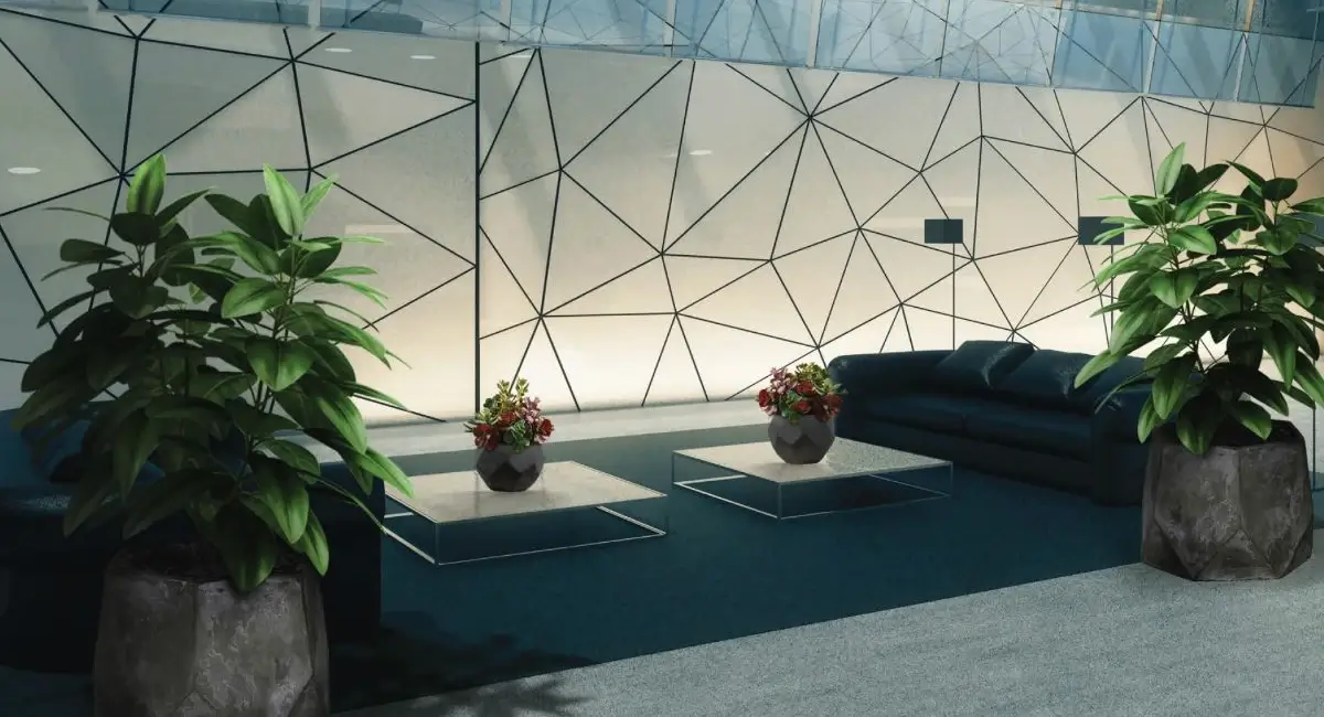 vaste hall circulant aménagé avec fauteuils et plantes variées